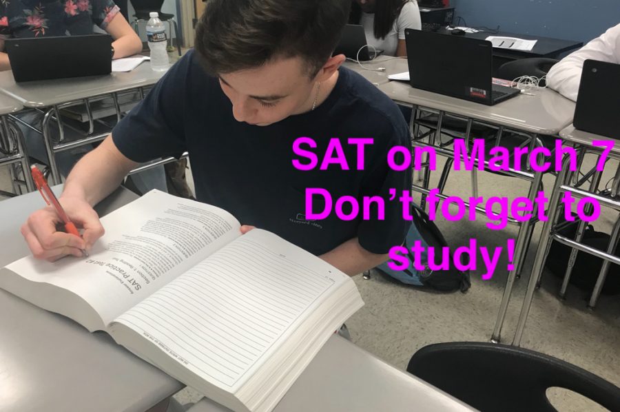 Junior, Jacob Bolger prepares by reading the SAT study guide.