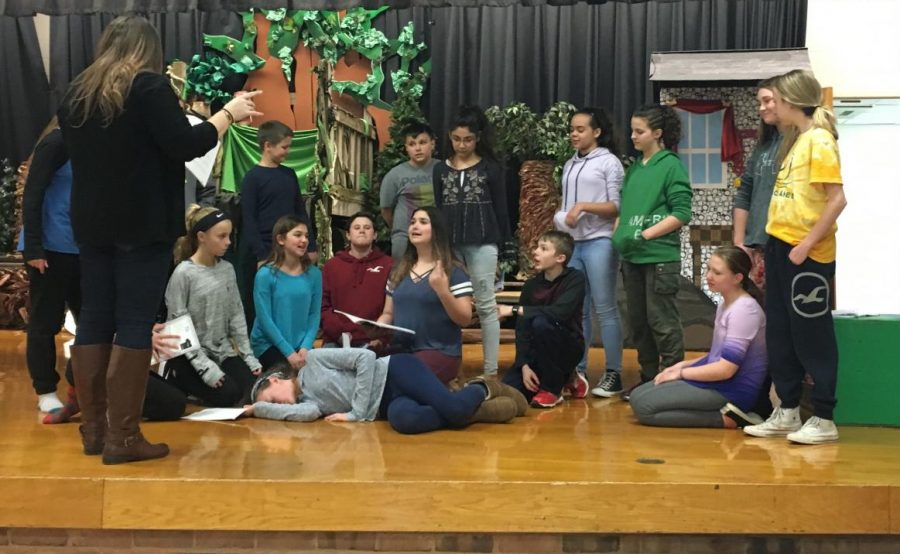 Students rehearse blocking for a scene in which Wendy is asleep, under the direction of Ms. Heeley