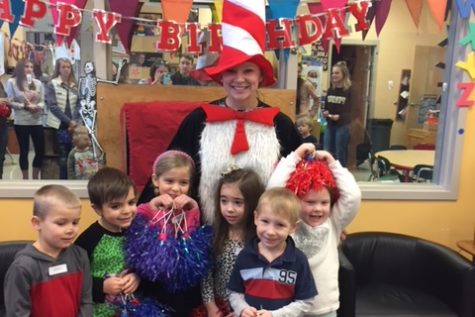 Grady, Tucker, Harlow, Paisley Liam, and Cate in front of Kaycee Morris dressed up as " Car in the Hat".  