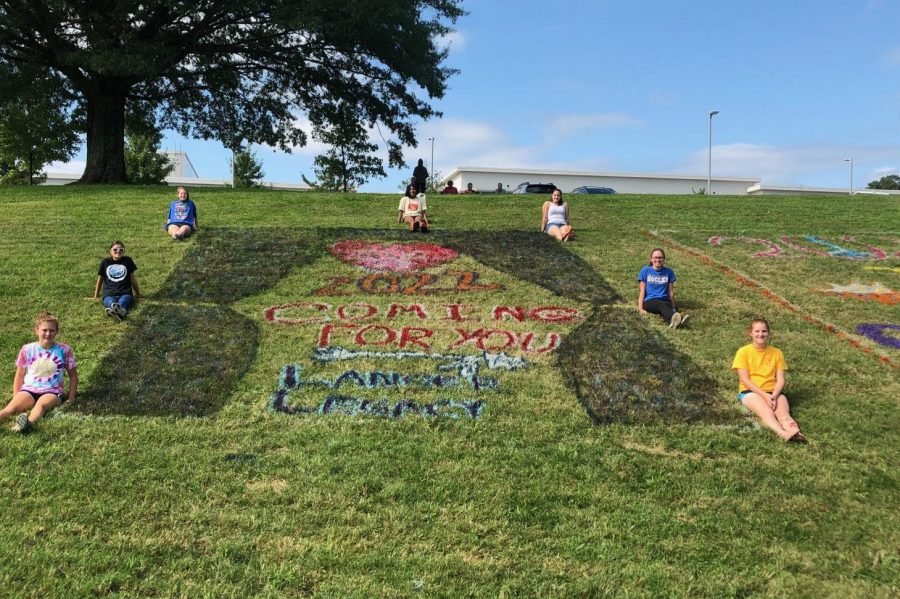 The class of 2022 surrounds their hill painting 