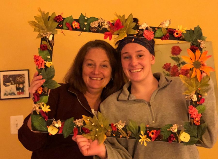 Katie Roach and her mom, Susan Roach, pose with a festive picture frame. 
