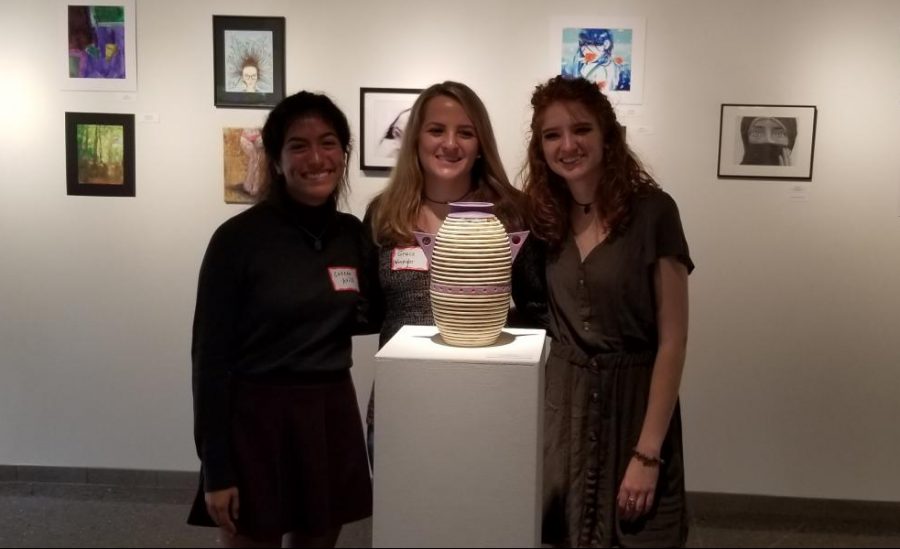 Colleen Avila, Grace Winpigler, and Shelby Tkacik posing with Winpiglers winning piece.