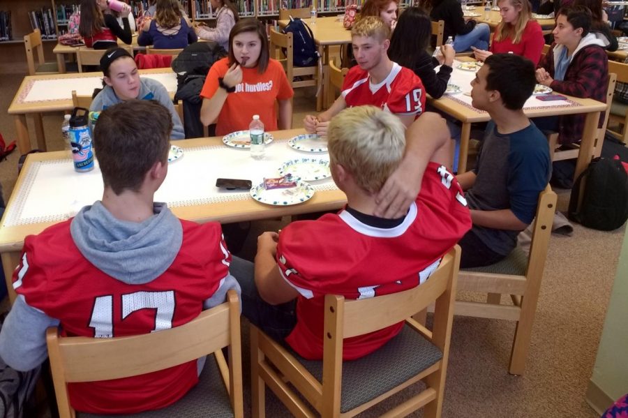 Students converse over school issues while having lunch