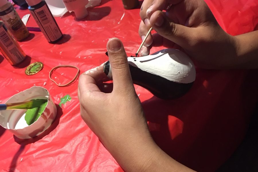 Paint on two black eyes.