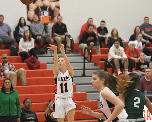 Shay Arneson shoots and makes a three-pointer.