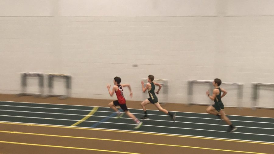 Freshman Brad Rose competes against two runners from Century High School in the 800 meter run.