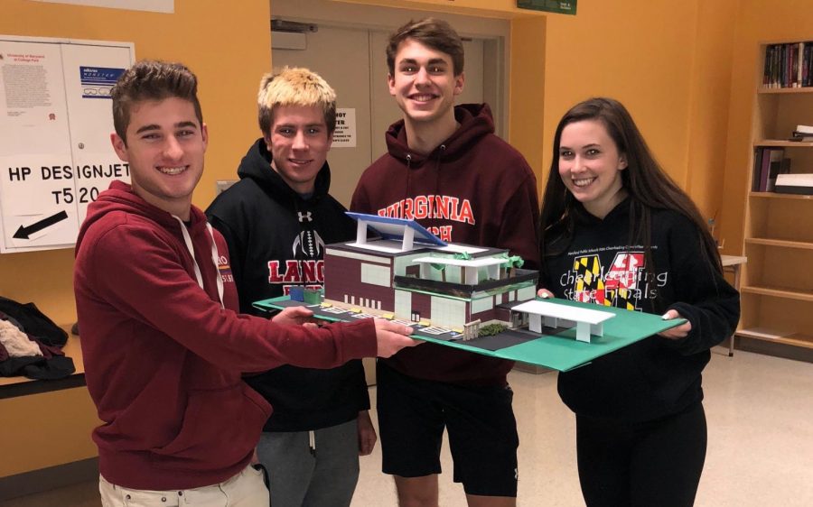 Catie Jo Tansey, Nick Hayslett, Colin Choudhary, and Alec Deyaert showcase their model.