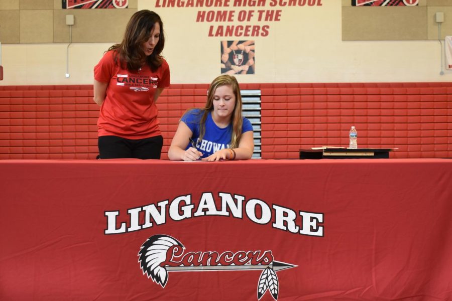 Paige+Wilhelm+signs+her+National+Letter+of+Intent+for+Chowan+University+softball.