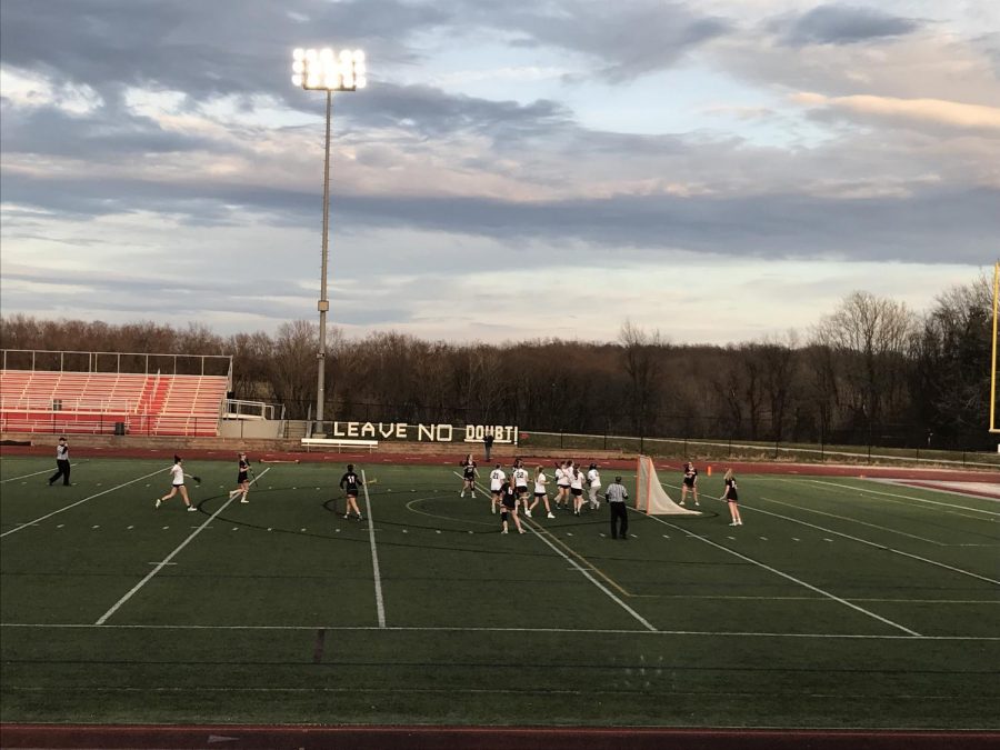 The Girls Varsity Lacrosse warms up before their game. 