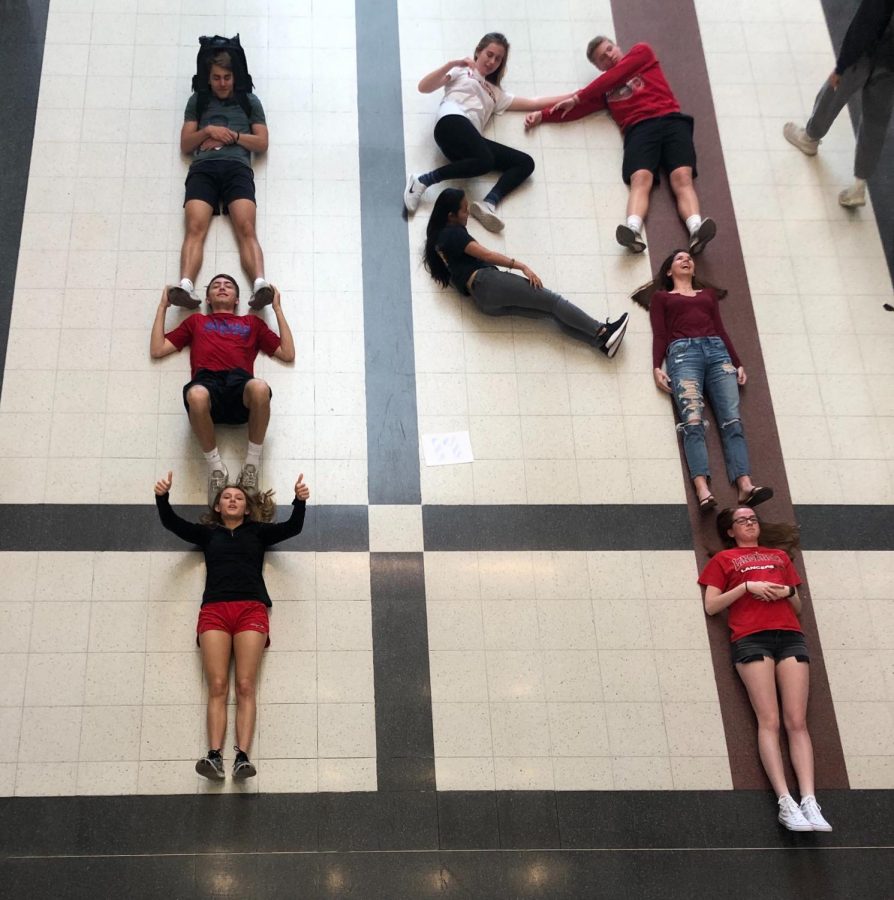 Senior SGA leaders pose in the shape of a "19".