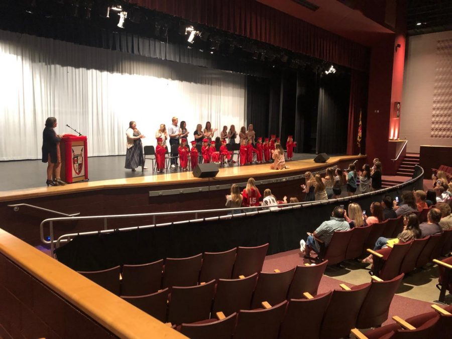 17 preschoolers stand with their senior buddies. 