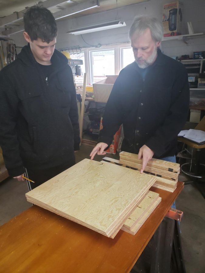 Eric Daniels and his uncle, Kevin Daniels planning the library