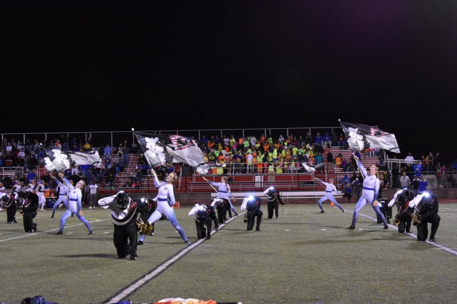 Marching Band and Color Guard performs, with the theme of the moon landing.
