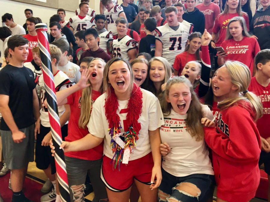 Friday: Junior Morgan Miller and members of the Class of 2021 celebrate winning the spirit stick.