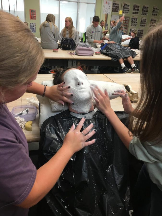Jacob's face is now fully cover with plaster strips. 