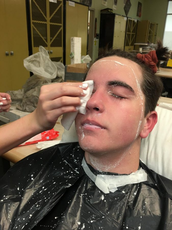 Mary Sherwood wipes off the plaster from Jacob's eyes 