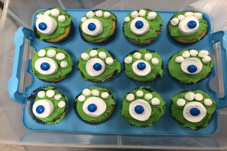 Mrs. Rebetsky makes monster cupcakes for the journalism students. 