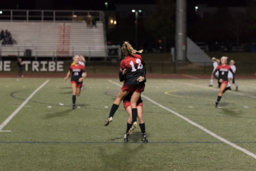 Taylor Ferguson and Nora Salter celebrate after Fergusons goal to tie the game.