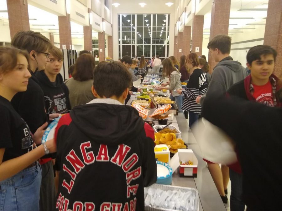 Techies enjoy a delicious tailgate-style dinner pot-luck.