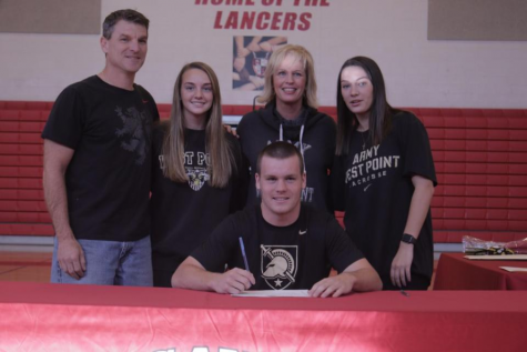 Will Coletti poses with his family after signing his National Letter of Intent.
