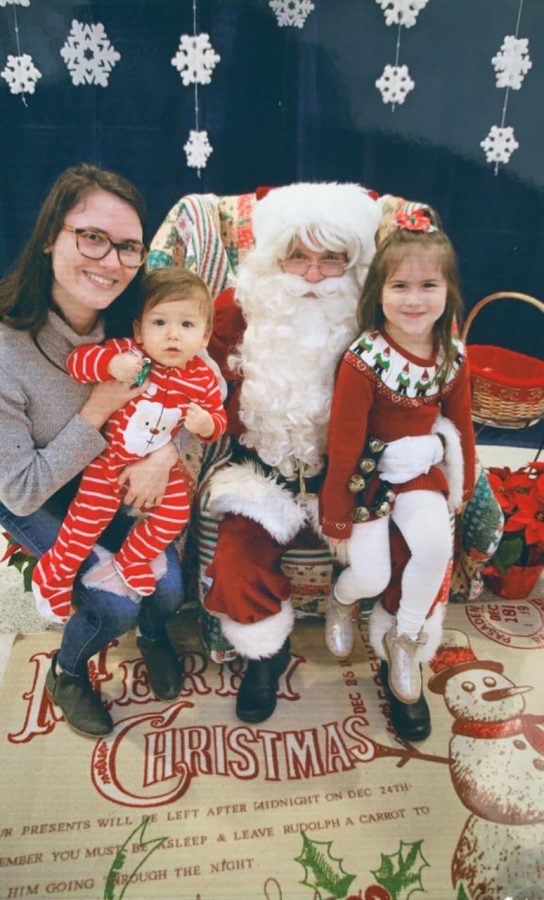 Graduate Anna Meushaw and children return to campus for Lancer Candy Lane and a visit with Santa.