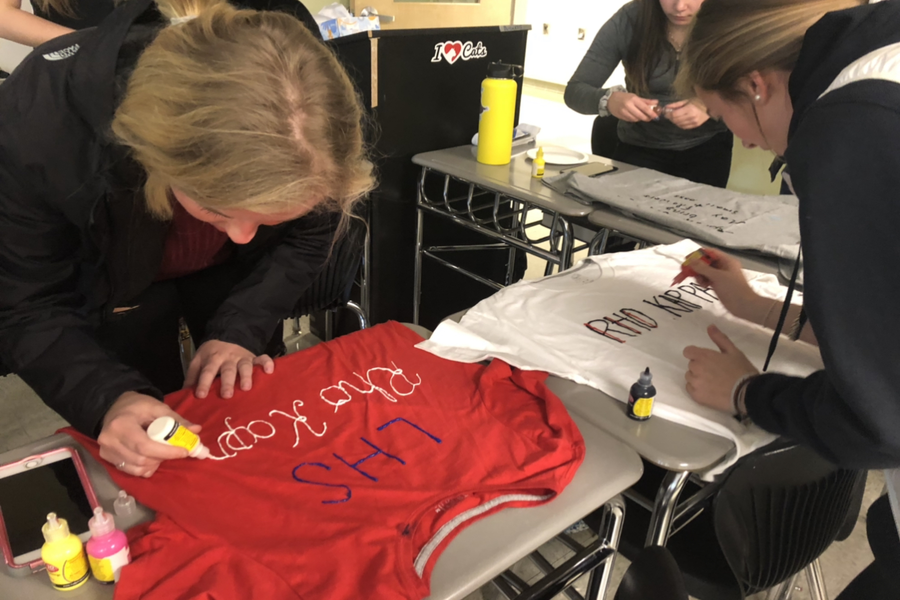 Maddy Spisso and Rachel  Hall design their own Rho Kappa t-shirts.