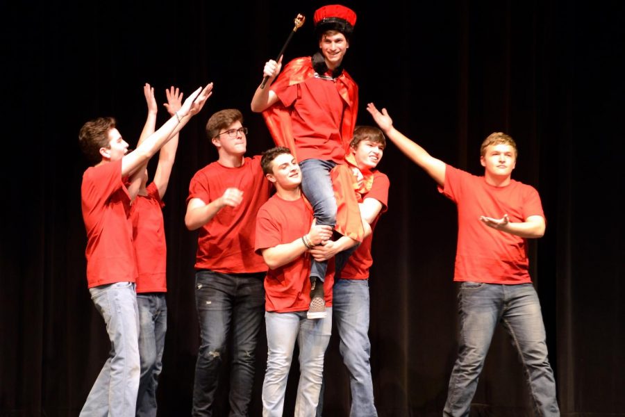 Contestants hold up Braden Weinel in celebration after hes crowned Mr. Linganore