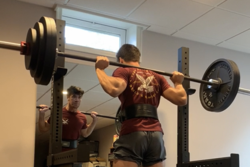 Senior Zach Tilmont squats over 200 pounds. After five months in quarantine, Zach was able to reach his squatting goal.