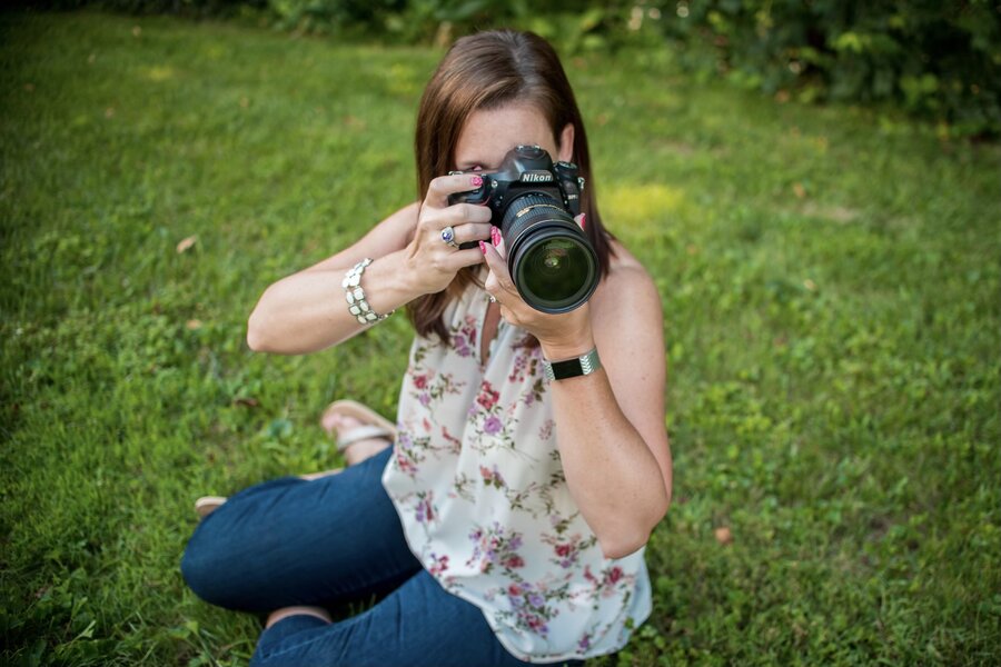 Stacey Markel focuses to get just the right angle for the photo she has in mind.