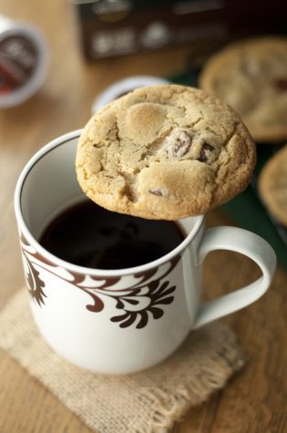 The addictive chocolate coffee cookies sitting on top of a coffee cup