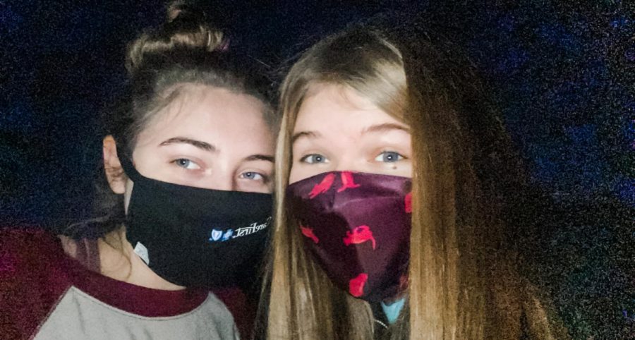 Caroline Hobson and Madeline Hull posing for a picture while wearing face-masks back in March 2020. 