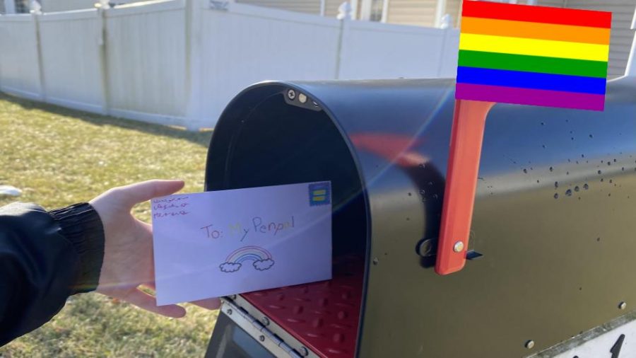 GSA student mailing a letter to their penpal across the county.