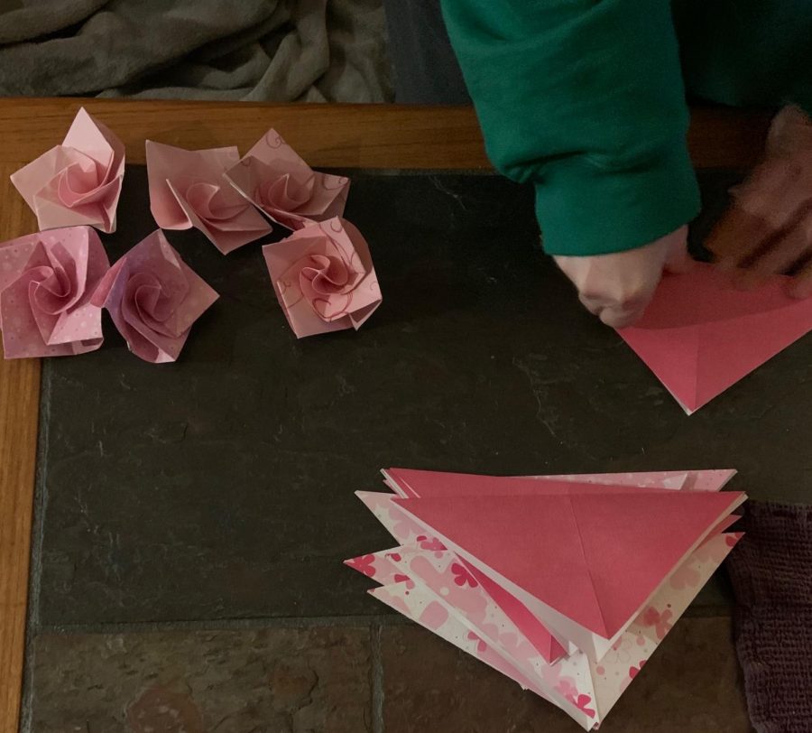 Molly Granger folds origami roses for teacher appreciation Valentines.
