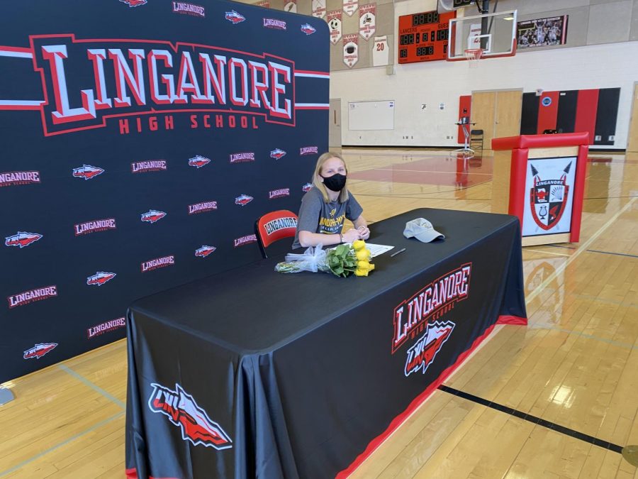 Each athlete had their own individual ten-minute time slot to hear their coach’s speech, sign their National Letter of Intent and take pictures. Samantha Hoefs signed to Randolph-Macon. She celebrated with her immediate family--smiling through her required mask.