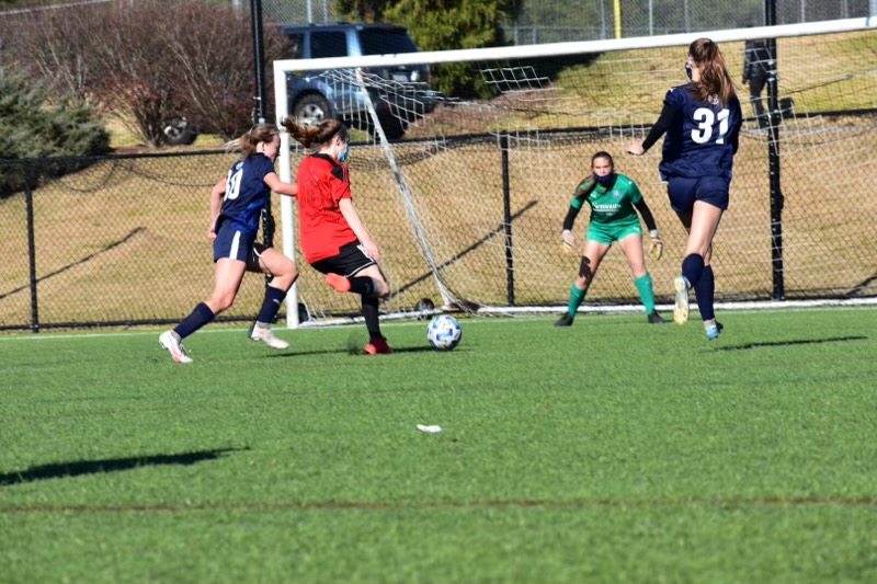 She shoots. She scores!! Action shot right before Catherine scores a goal during a soccer ID camp.