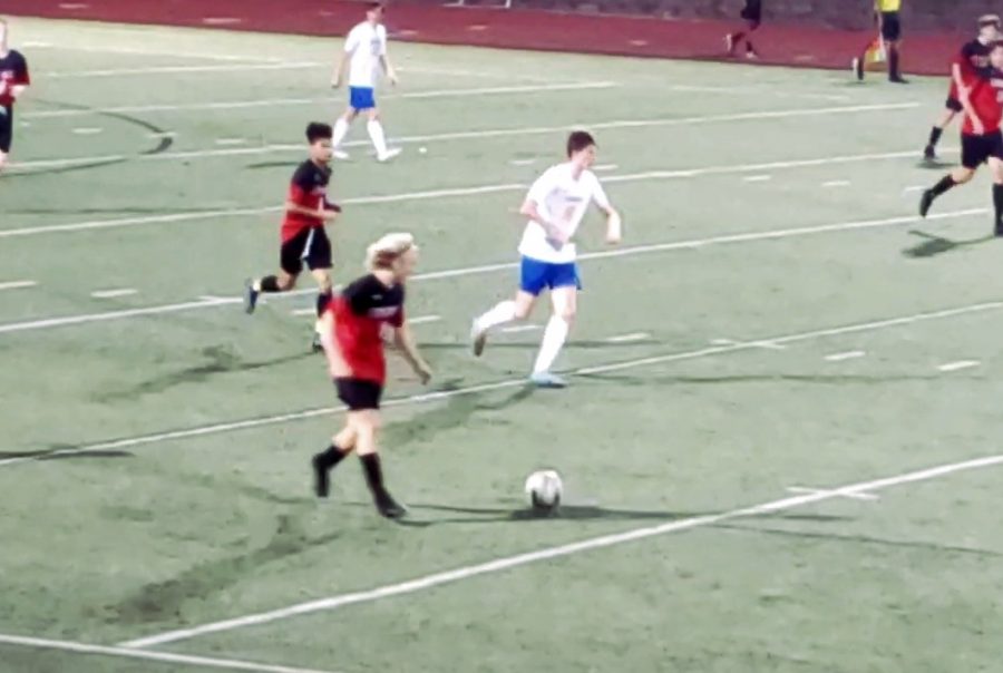 Sophomore Brady Densock dribbles the ball up the field. 