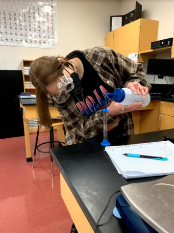 Junior Chloe Trevino measures the meniscus by looking at it from eye level. 