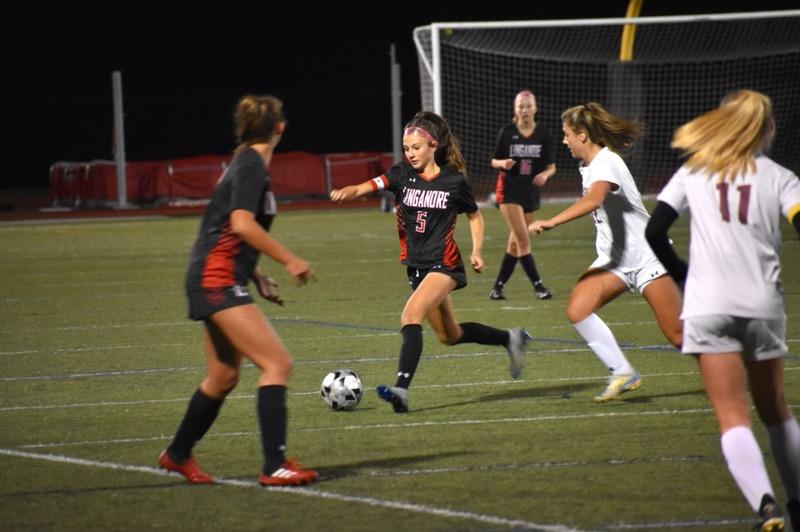 Senior and captain Victoria Garofolo (#5) putting her all into one of the last girls varsity soccer game of the season. 