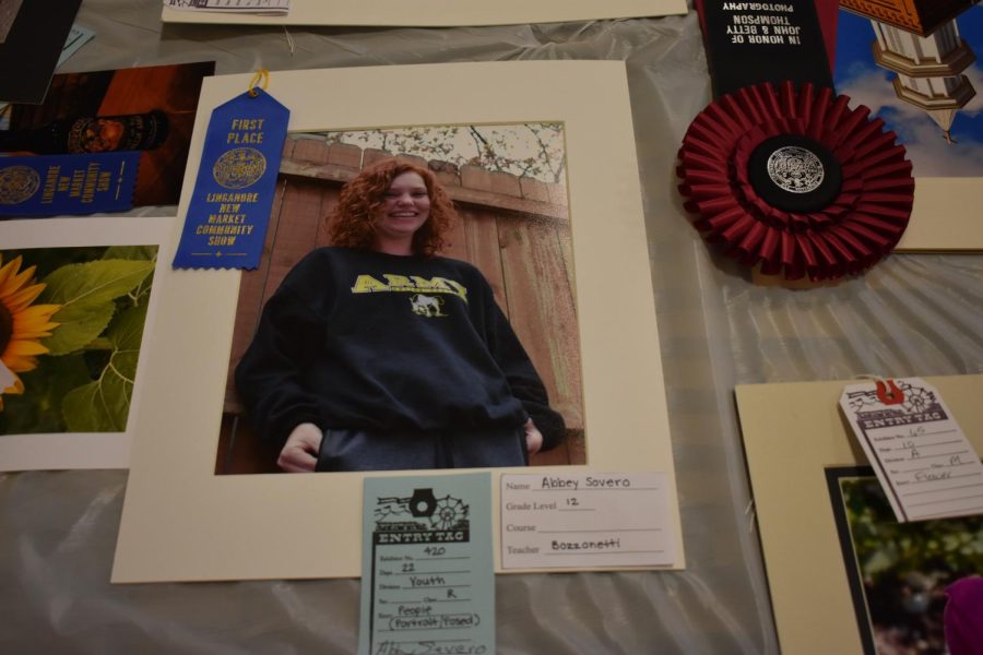 Senior Paige Kapeluch, poses for a portrait, earning  first place in the portrait category.