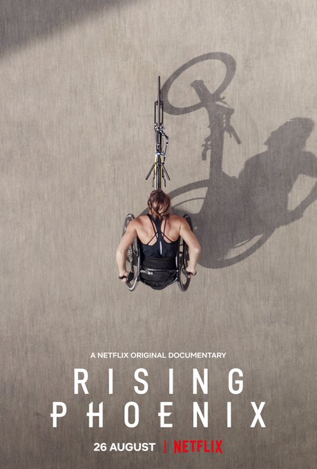 Tatyana McFadden trains on the road in this overhead photo. This is also the Rising Phoenix film poster that was used to advertise the documentary.