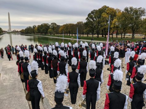 The LHS Lancer Marching Band stands at attention after playing the National Anthem at the Lincoln Memorial.