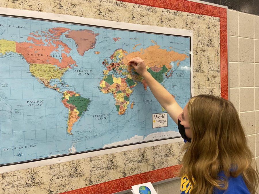 Junior Camryn Mackay used a pin to mark where her family is from. Student Government Association provided and displayed a map for students, staff and families to mark where their ancestors are from. 