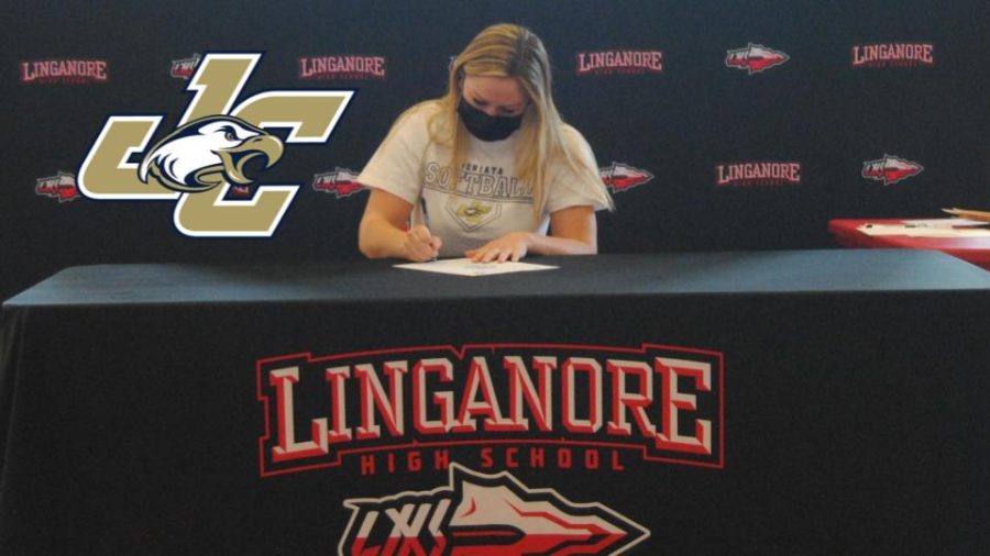 Claire Thomas signs her national letter of intent to continue her softball career at Juniata College.
