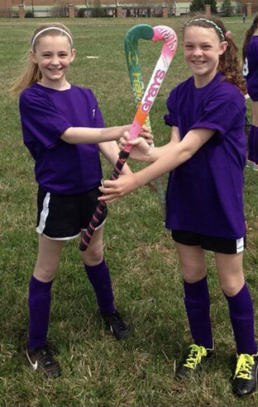 Emma Watkins (right) and Maeve Smarick (left) at Field Hockey camp in elementary school. 