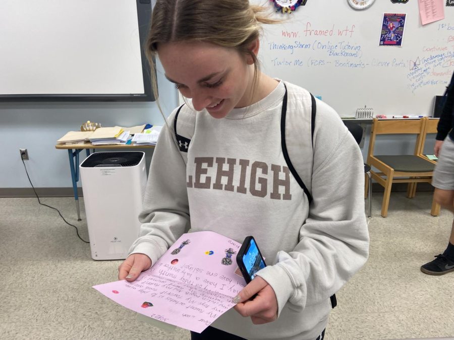Senior+National+English+Honor+Society+Member+Leah+Coletti+reads+her+pen+pals+first+letter.+