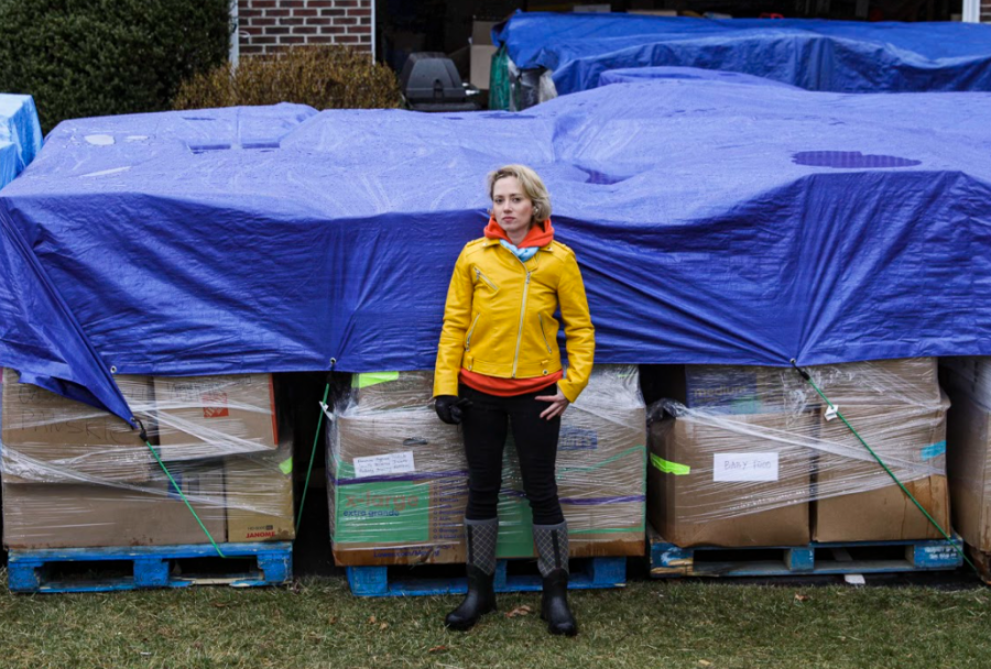 One woman and hundreds of supplies. Annie Raush-Gernet stands in front of the donations collected in her front yard.