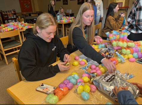 Seniors Olivia Fullarton and Grace Doy fill eggs in the library. 