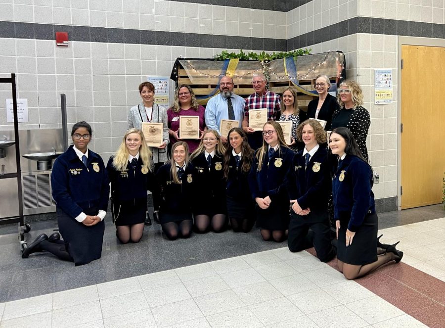 The FFA officers pose with teachers who were honored at the banquet. 