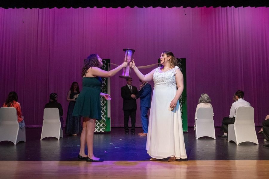 Leads Ellie Blake (Lauren Hackett) and Katherine Blake (Malia Smaha) celebrate the wedding at the end of the musical while returning to their bodies. (Mike Miller)