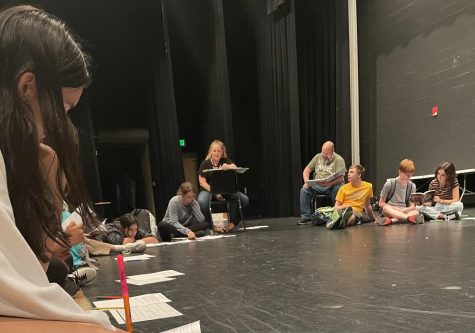 The cast of Puffs participate in a read-through of the script at their first rehearsal. 